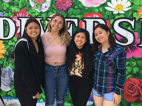 California student mural brings ‘flowers of one garden’ to life