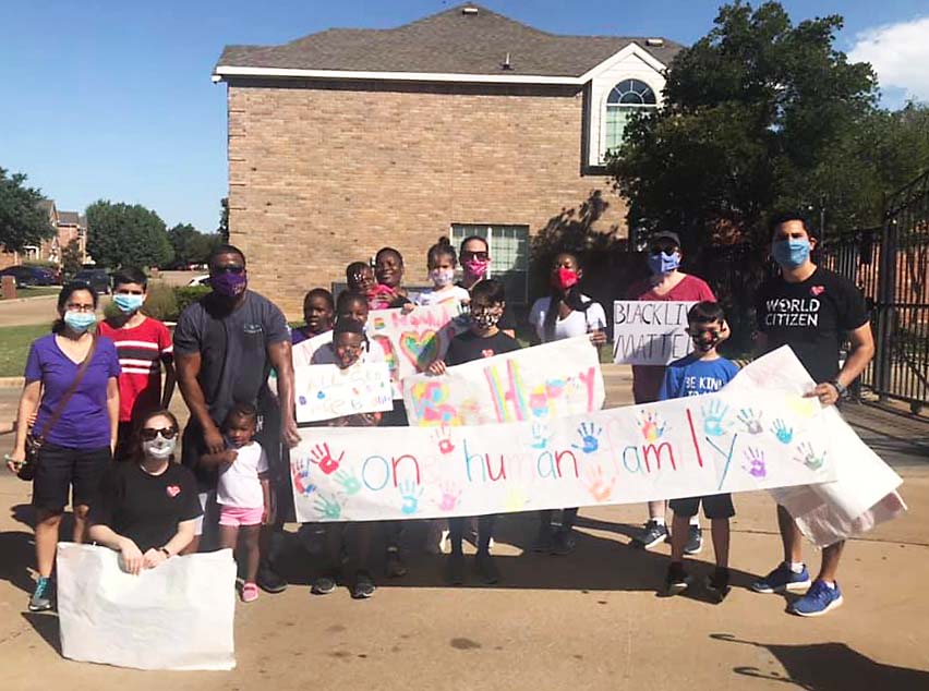 Unity Walk attracts 55 neighbors and lots of waves, honks