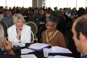 A delegate to the 115th U.S. Bahá'í National Convention studies guidance as part of a preparatory deepening the morning of May 18,, 2023. Photo by Jasmin Kemp