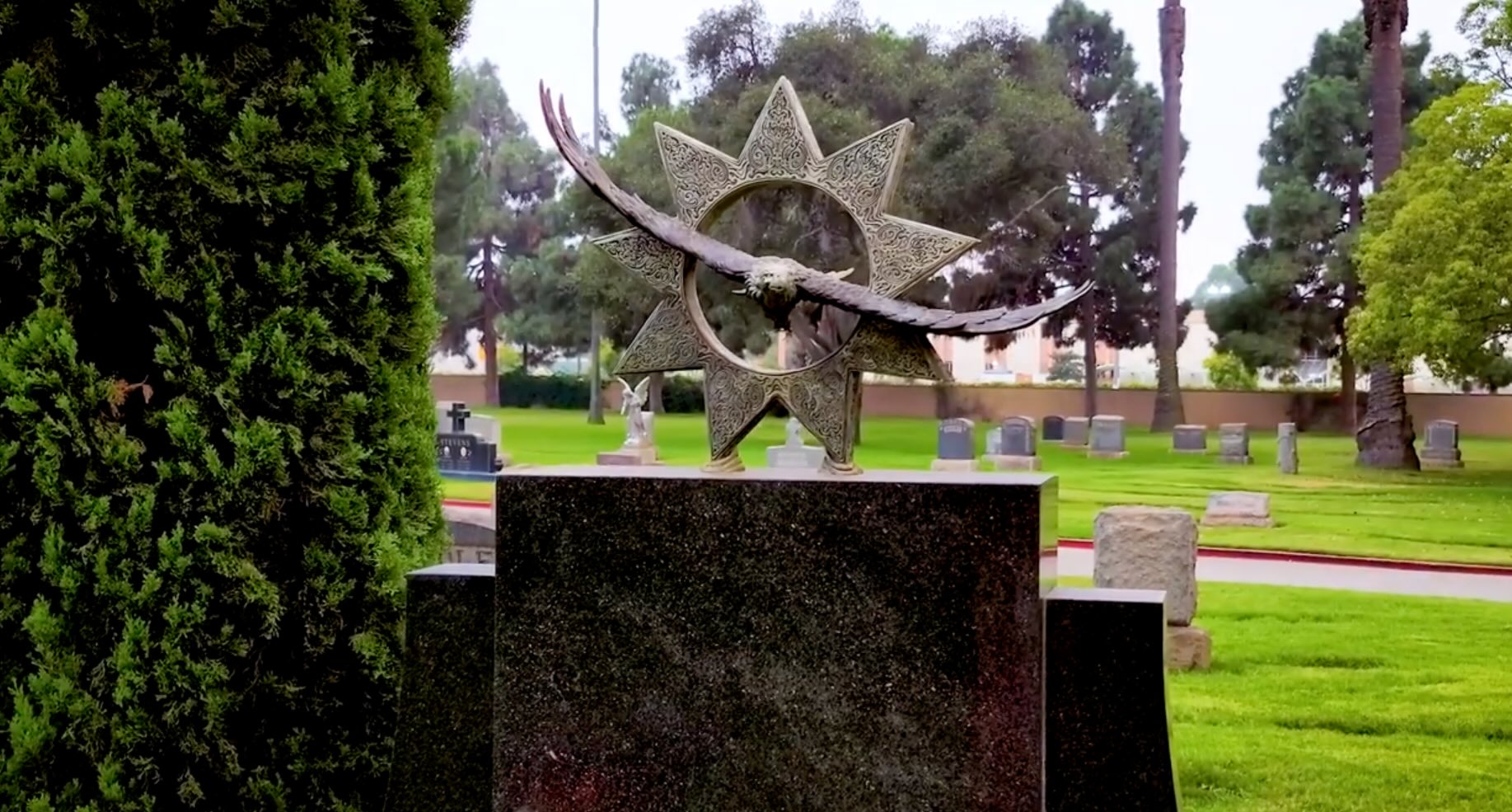 Thornton Chase headstone ornamentation of a nine pointed star and a hawk.