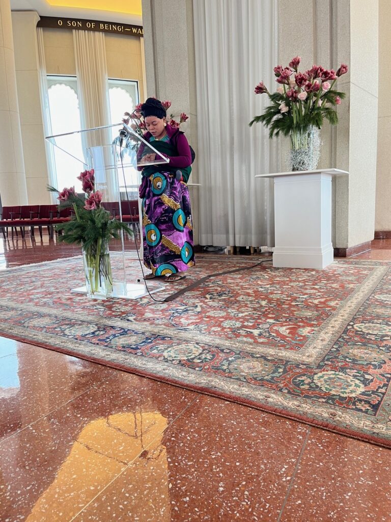 Congolese Bahá'ís from Galesburg assemble in prayer during devotions at the House of Worship.