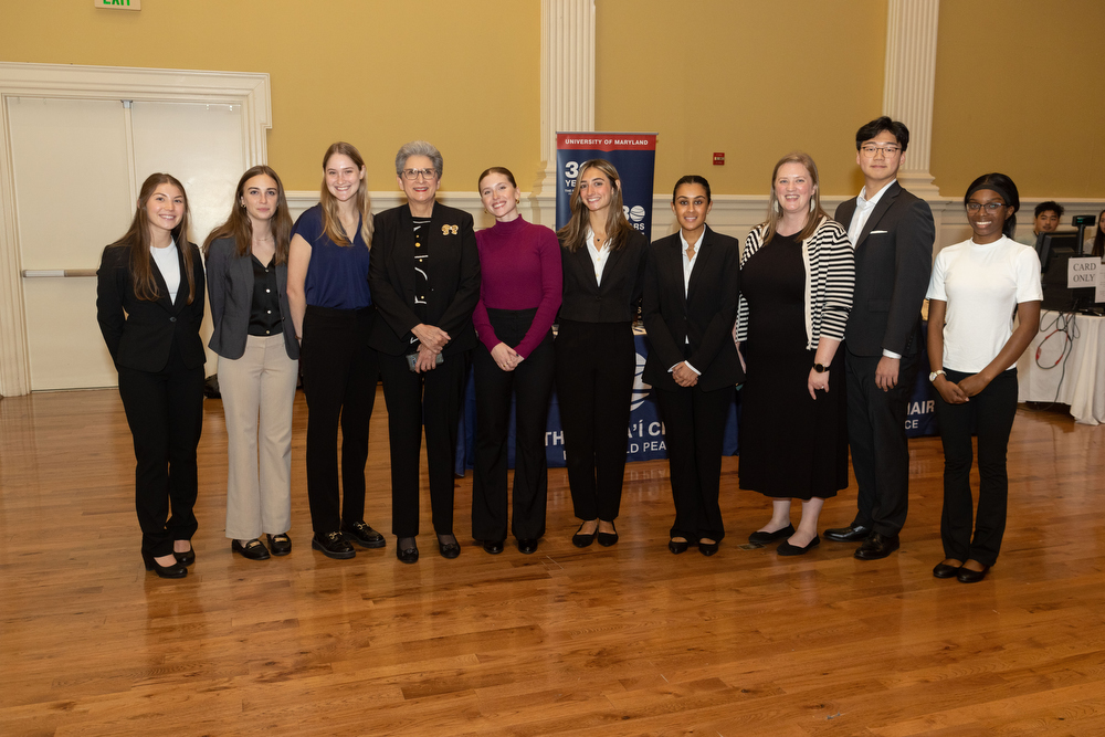 Two representatives of the Bahá'í Chair for World Peace meet with a group of student ambassadors for the University of Maryland.