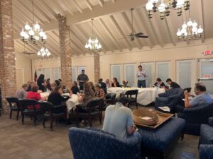 Large group eating at feast during social portion